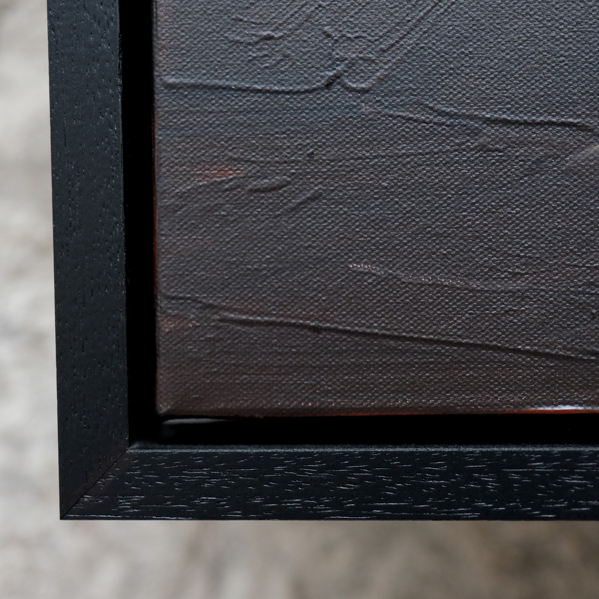 Close-up of the lower-left corner of Afterlight, showing the canvas weave, raised dark paint and black frame.
