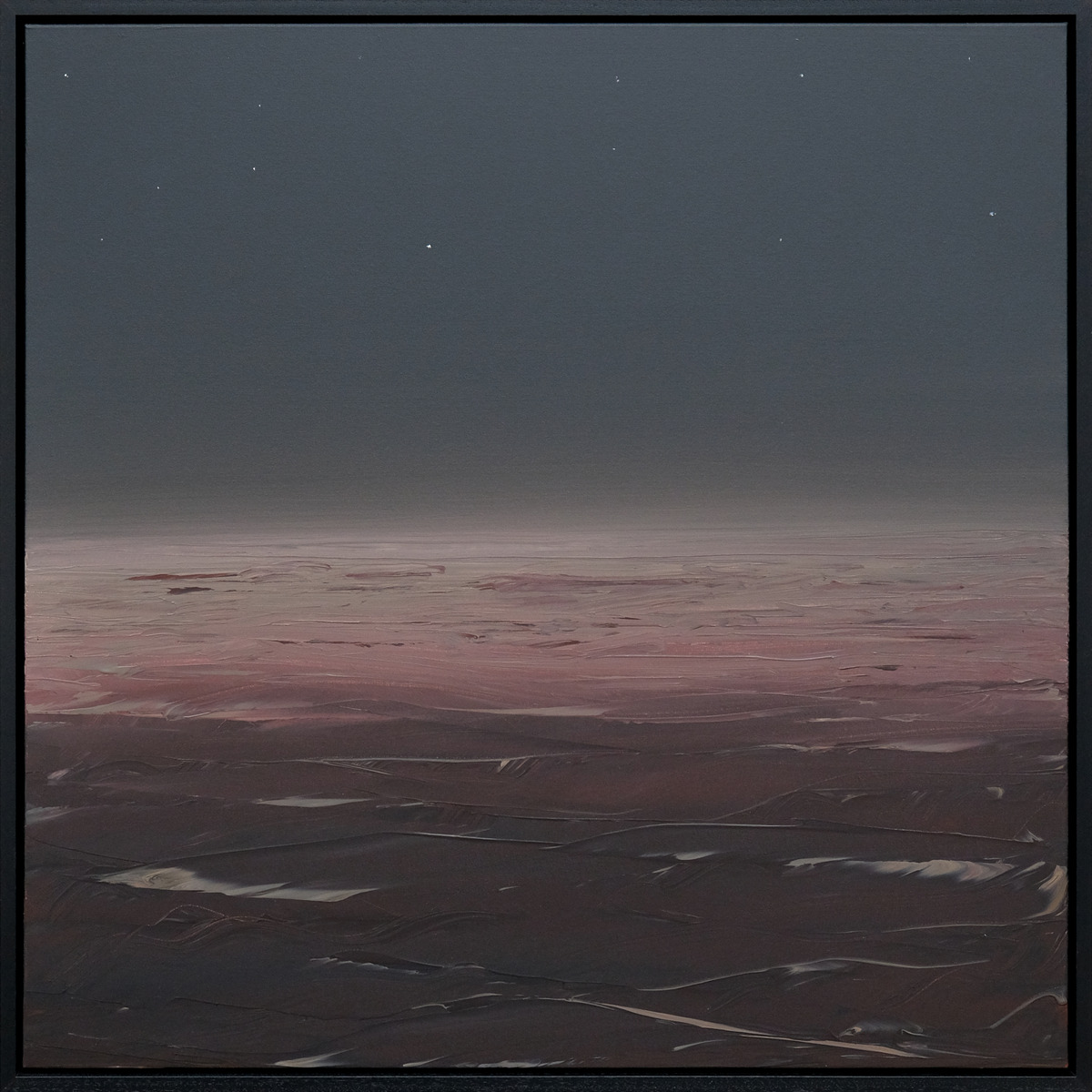A seascape with a dark sky dotted with small pale points above a pink horizon and dusky waves in a black frame.