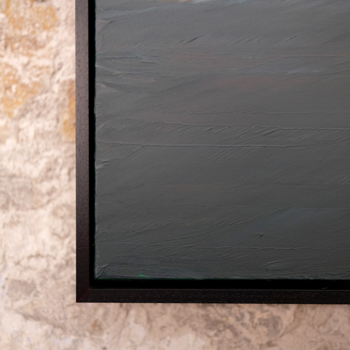 Close-up of the lower-left corner of The Quiet Line, showing broad ridges of blue-green paint, canvas texture and the black frame.