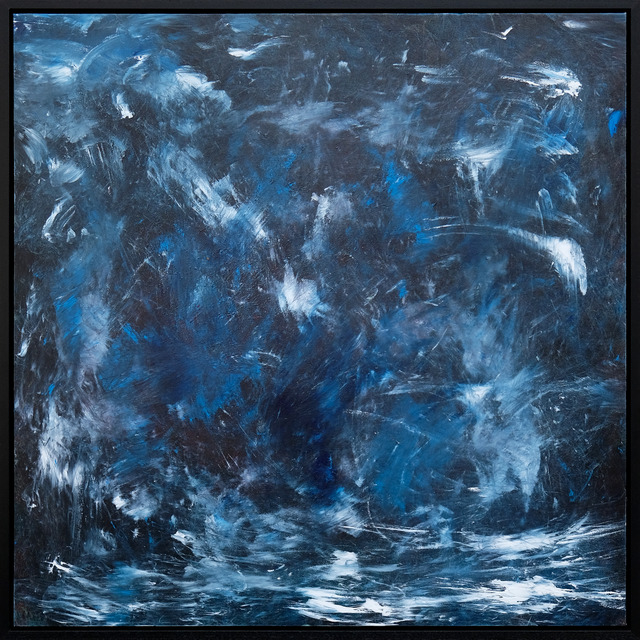 A seascape in deep blue, charcoal and pale blue, with sweeping white marks across a textured surface, presented in a black frame.